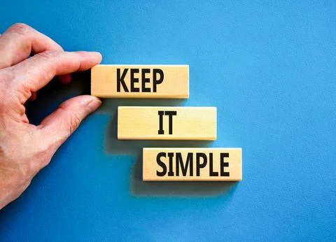 Keep it simple symbol. Concept word Keep it simple on beautiful wooden bloc.. Stock Photos