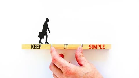 Keep it simple symbol. Concept word Keep it simple on beautiful wooden bloc.. Stock Photos
