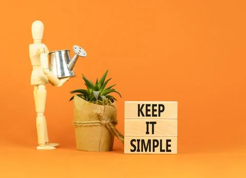 Keep it simple symbol. Concept word Keep it simple on beautiful wooden bloc.. Stock Photos