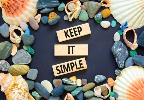 Keep it simple symbol. Concept word Keep it simple on beautiful wooden bloc.. Stock Photos