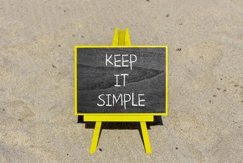 Keep it simple symbol. Concept word Keep it simple on beautiful black chalk.. Stock Photos