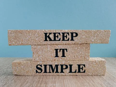Keep it Simple symbol. Concept words Keep it Simple on brick blocks. Stock Photos