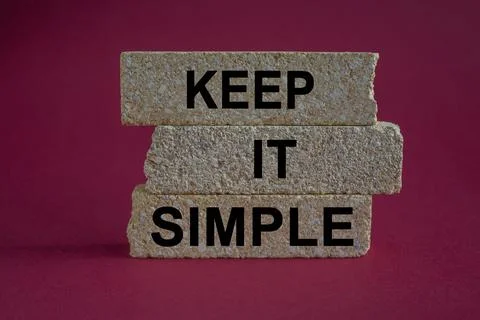 Keep it Simple symbol. Concept words Keep it Simple on brick blocks. Stock Photos