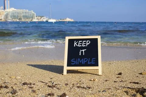 Keep it Simple symbol. Concept words Keep it Simple on chalk blackboard. Be.. Stock Photos