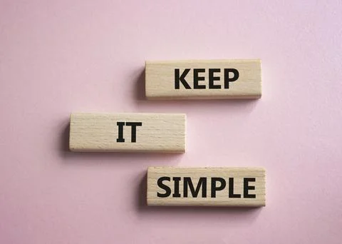 Keep it Simple symbol. Concept words Keep it Simple on wooden blocks. Beaut.. Stock Photos
