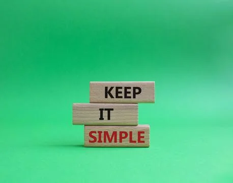 Keep it Simple symbol. Concept words Keep it Simple on wooden blocks. Beaut.. Stock Photos