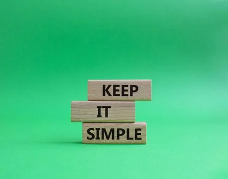 Keep it Simple symbol. Concept words Keep it Simple on wooden blocks. Beaut.. Stock Photos