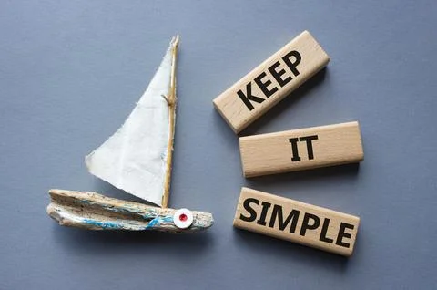Keep it Simple symbol. Concept words Keep it Simple on wooden blocks. Beaut.. Stock Photos
