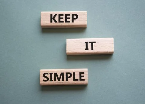 Keep it Simple symbol. Concept words Keep it Simple on wooden blocks. Beaut.. Stock Photos