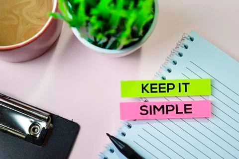 Keep it Simple text on sticky notes with office desk concept 写真素材
