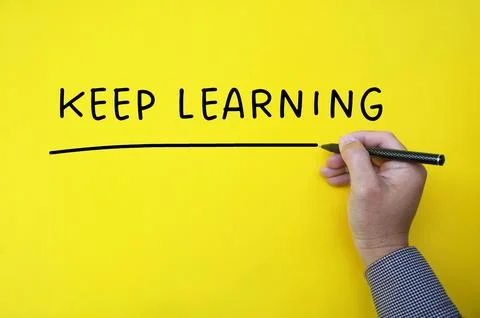 Keep learning text on yellow cover background. Stock Photos