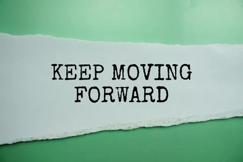 Keep Moving Forward message written on white paper with torn paper background Stock Photos
