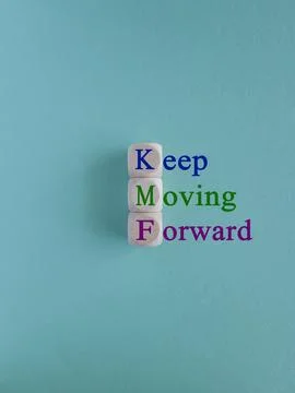 Keep moving forward symbol. Concept words Keep moving forward on cubes Stock Photos