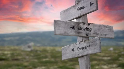 Keep moving forward text engraved in wooden signpost outdoors in nature durin Stock Footage 170629629