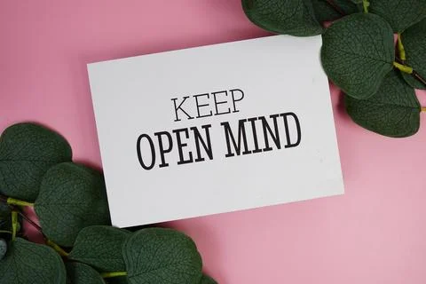 Keep Open Mind Quote text on paper card top view on pink background, Motiva.. Stock Photos