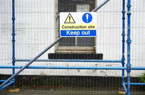 Keep out construction in progress site sign on fence Stock Photos