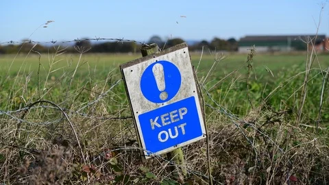 Keep out warning sign in countryside united kingdom Stock Footage 126089977