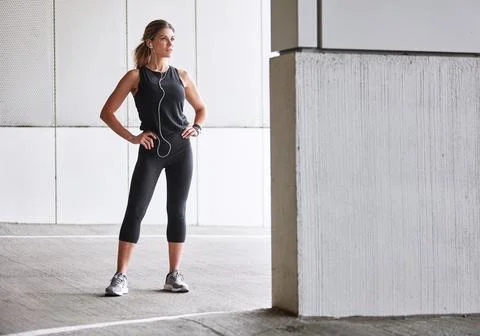 Keep pushing, keep persisting. a sporty young woman taking a break while Stock Photos