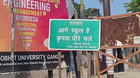 Keep Slow School Front Signboard on Village Road Stock Footage 313571444