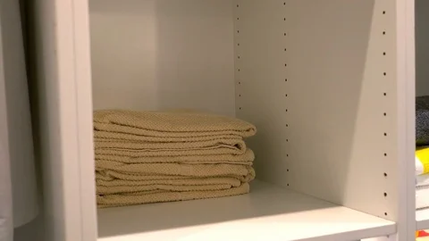 Keep stack of towel into shelf Stock Footage 79432212