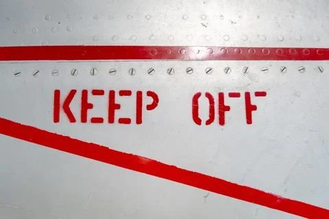 Keep Off warning sign on the fuselage of an old aircraft Stock Photos