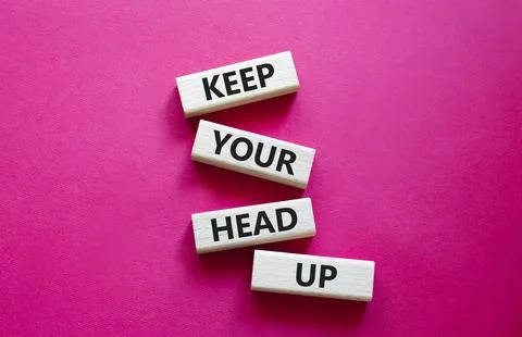 Keep Your Head Up symbol. Concept words Keep Your Head Up on wooden blocks... Stock Photos