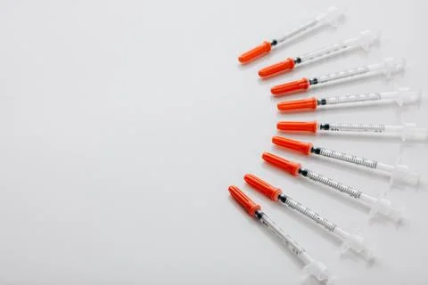 Keep yourself protected against diseases. High angle shot of needles in an empty Stock Photos