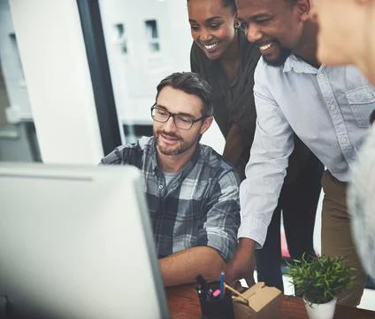 Keeping everyone on the same page. High angle shot of a group of businesspeople Stock Photos