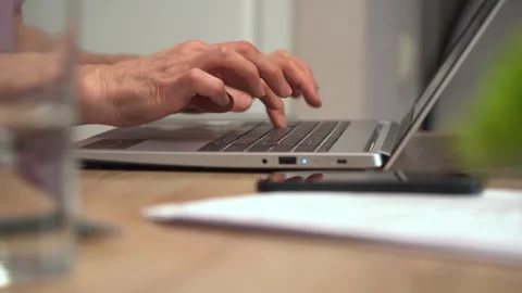 Keeping a personal diary: a woman writes down her thoughts and types notes Stock Footage 303577553