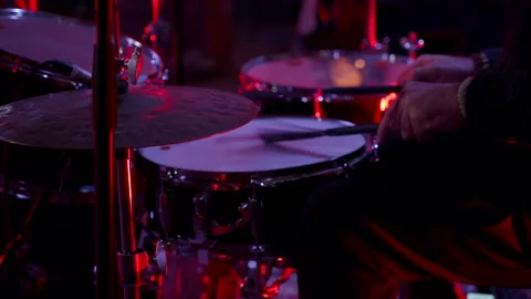 Keeping time. Man drummer takes turns beats on each drum. Music industry Stock Footage 213466387