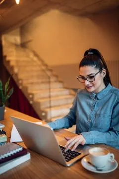 Keeping track of her notes online Stock Photos