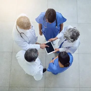 Keeping track of their patients progress. High angle shot of medical Stock Photos