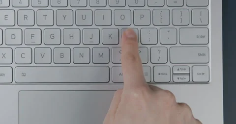 Keeps track of the object. The girl is typing a message with one finger. Stock Footage 154694739