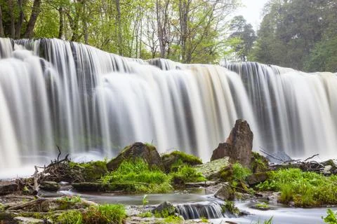 Keila Joa waterfall, long exposure and spring time with greenery. Stock Photos