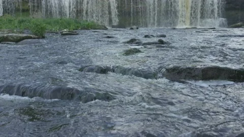 Keila waterfall with stream in foreground in summer evening Stock Footage 159980593