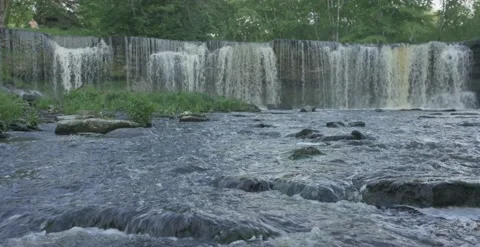 Keila waterfall with stream in foreground in summer evening Stock Footage 159980622