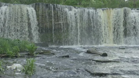 Keila waterfall with stream in foreground in summer evening Stock Footage 159982880