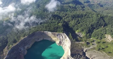 Kelimutu volcano colored lakes flyby 2 (zoom out) Stock Footage 78734829