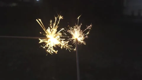KEMBANG API 01Holding burning sparkler in hands. Festive mood Stock Footage 305506961
