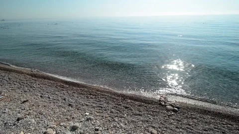 Kemer, Beldibi: Empty stone beach and waves splash on the shore Stock Footage 118967200