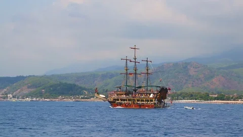 Kemer, Turkey - July 30, 2018 - A large sailing boat sails in the blue Medite Stock Footage 99354550