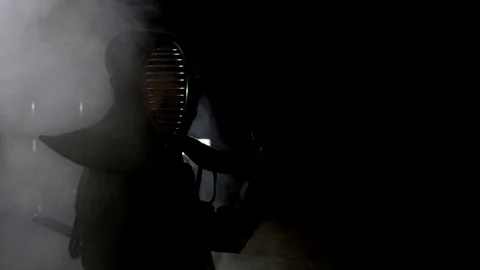 Kendo warrior demonstrates fighting attacks Stock Footage 77233093