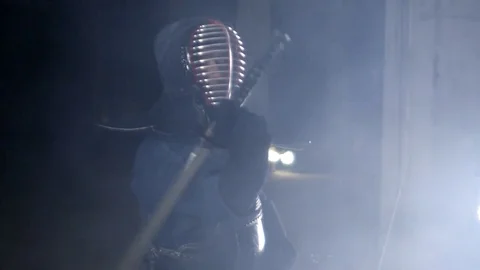 Kendo warrior demonstrates fighting attacks Stock Footage 77233103