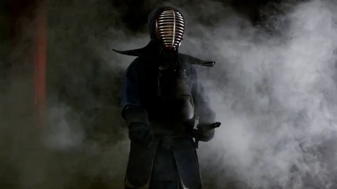 Kendo warrior demonstrates fighting attacks Stock Footage 77233348