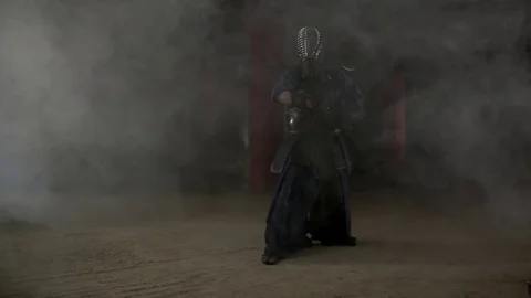 Kendo warrior demonstrates fighting attacks Stock Footage 77233400