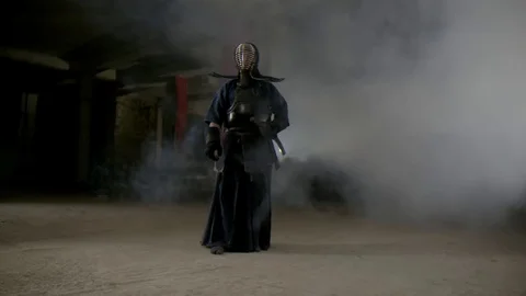 Kendo warrior demonstrates fighting attacks Stock Footage 77234181