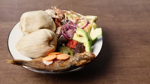 Kenkey With Fried Fish, Shrimps, Pear, Pepper Sauce and Fried Egg, Ghana Dish Video stock 346249761