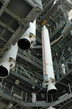 KENNEDY SPACE CENTER, FLA. - Another solid rocket booster is lifted into t... Stock Photos