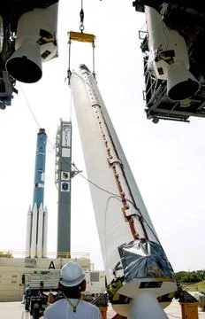 KENNEDY SPACE CENTER, FLA. - A solid rocket booster (SRB) is lifted to ver... Stock Photos