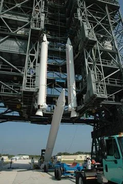 KENNEDY SPACE CENTER, FLA. -- A third solid rocket booster is raised off i... Stock Photos